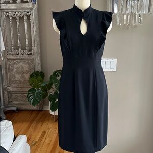 This beautiful,classic little black dress. 
Side zipper, keyhole hook&eye Size 6